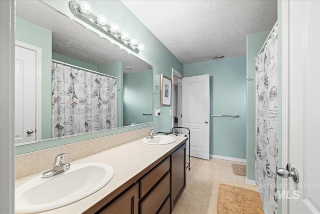 2972 N Saint James Pl, Boise, ID 83703 - bathroom featuring double vanity and a textured ceiling