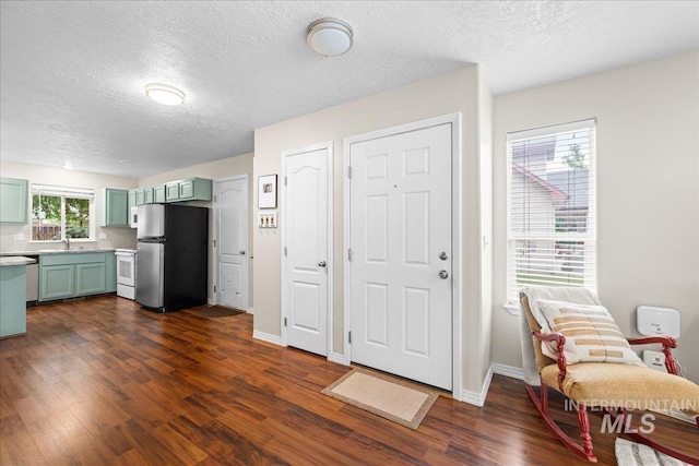 2972 N Saint James Pl, Boise, ID 83703 - foyer entrance with a textured ceiling and dark wood-type flooring