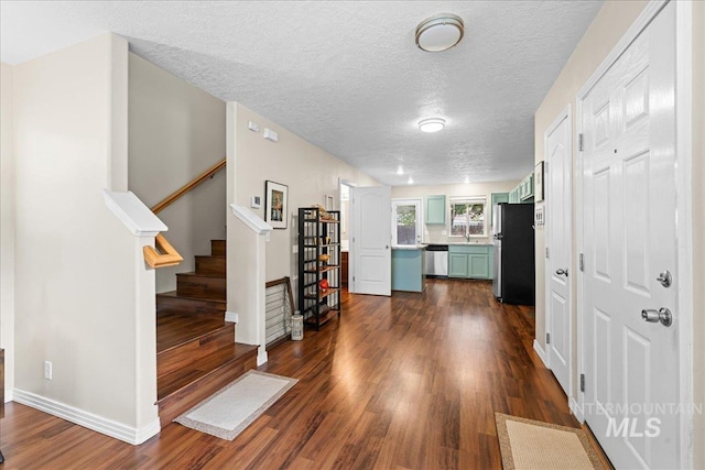 2972 N Saint James Pl, Boise, ID 83703 - entryway featuring dark wood-style flooring, stairs, and a textured ceiling