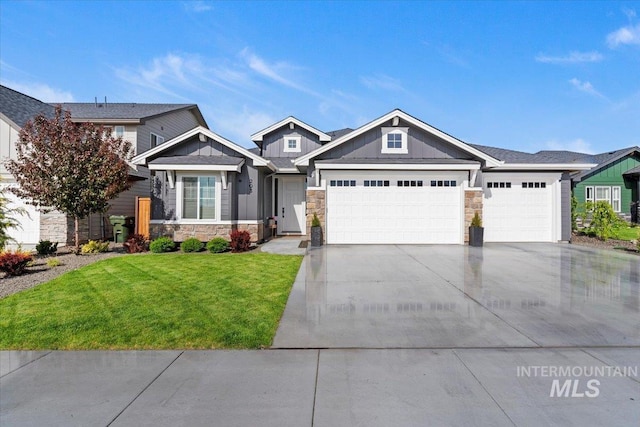203 S Fusion Ave, Kuna, ID 83634 - view of front of home featuring stone siding, board and batten siding, and an attached garage