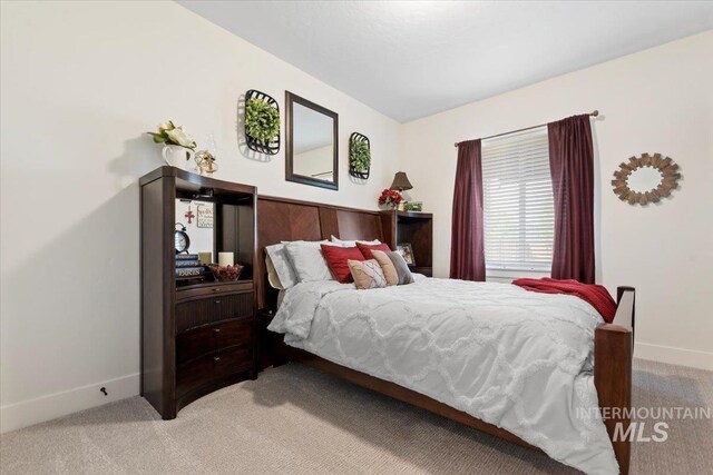 203 S Fusion Ave, Kuna, ID 83634 - bedroom with light colored carpet and baseboards