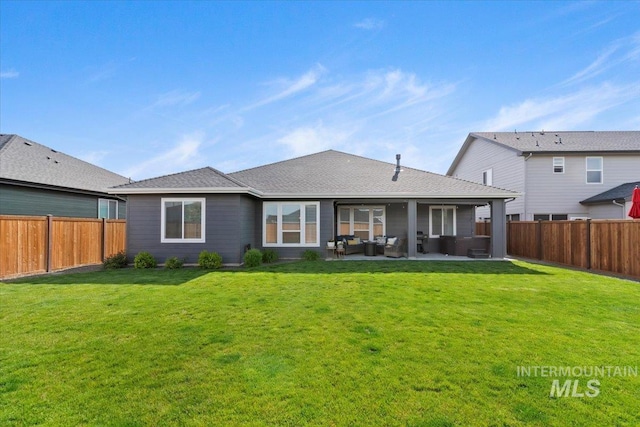 203 S Fusion Ave, Kuna, ID 83634 - rear view of property with an outdoor hangout area, a patio area, and a shingled roof