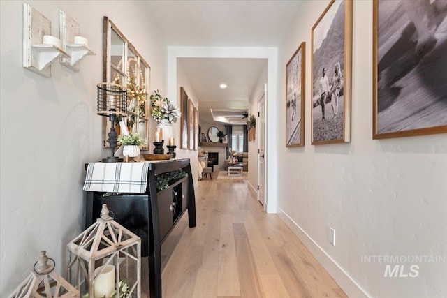 203 S Fusion Ave, Kuna, ID 83634 - hallway with wood-type flooring, baseboards, and recessed lighting