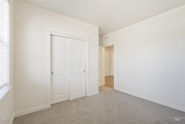 10663 W Catmint, Star, ID 83669 - unfurnished bedroom with carpet floors, a closet, and baseboards