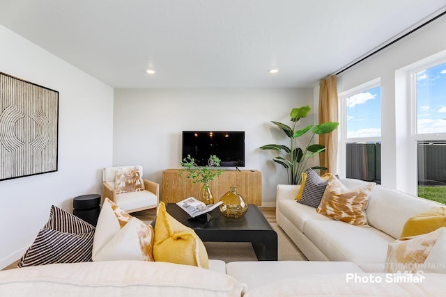 living area with recessed lighting, wood finished floors, and baseboards