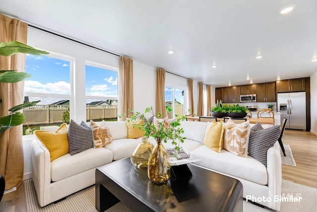 living room featuring light wood-style floors and recessed lighting