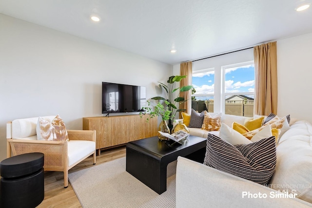 living room featuring light wood-style floors and recessed lighting