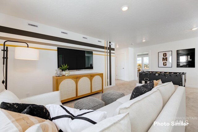 living room with carpet floors, recessed lighting, and baseboards