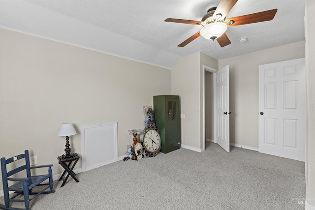 unfurnished bedroom featuring carpet floors, baseboards, and a ceiling fan