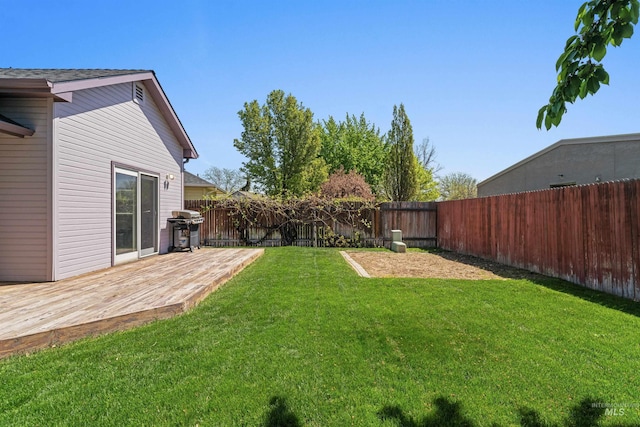 view of yard with a wooden deck