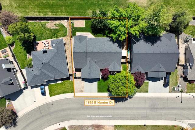 aerial perspective of suburban area with property boundaries highlighted