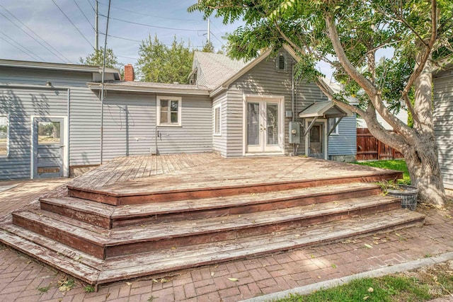 rear view of house with french doors and a deck