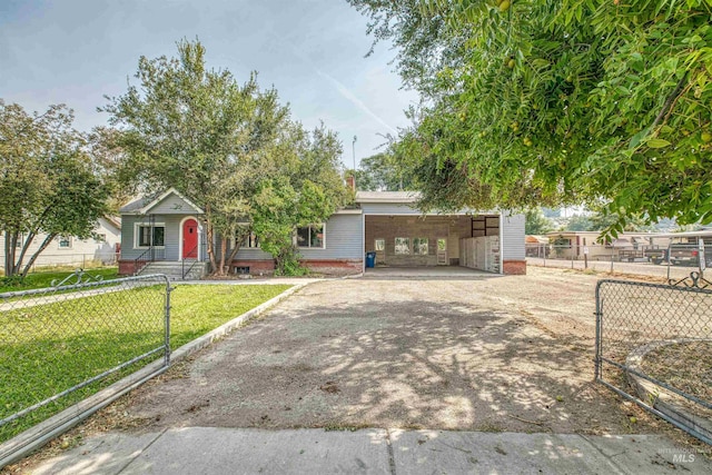 view of front facade with a front yard and a carport