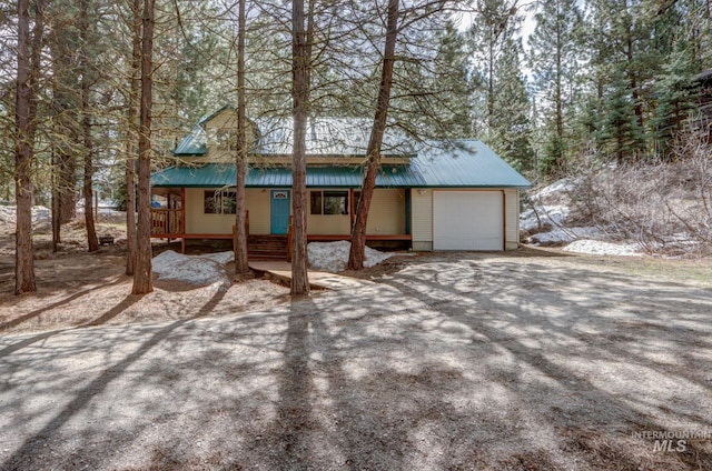 351 Estate Dr, Cascade, ID 83611 - exterior space with covered porch and an attached garage