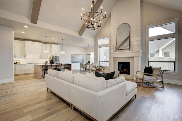 4219 W Thornapple Dr, Meridian, ID 83646 - living room featuring a chandelier, recessed lighting, high vaulted ceiling, light wood-style flooring, and a fireplace