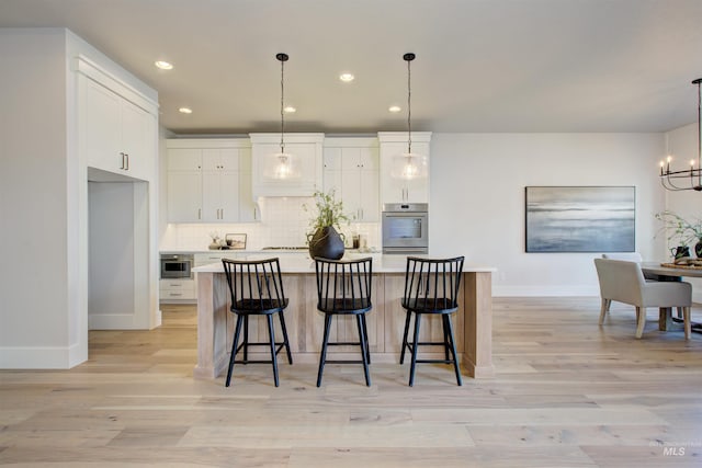 4219 W Thornapple Dr, Meridian, ID 83646 - kitchen featuring baseboards, a chandelier, white cabinets, tasteful backsplash, and recessed lighting