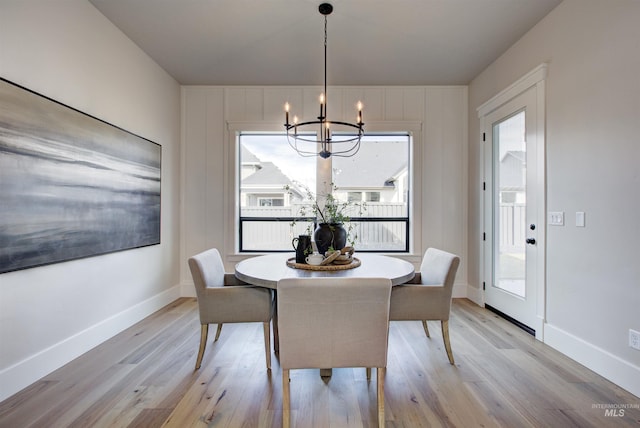 4219 W Thornapple Dr, Meridian, ID 83646 - dining space featuring a chandelier, light wood-type flooring, and baseboards