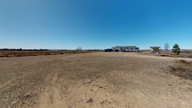 view of yard with a rural view