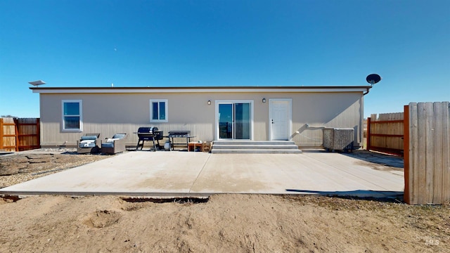 back of house with a patio, fence, and entry steps