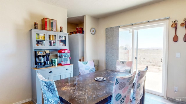 dining space featuring baseboards