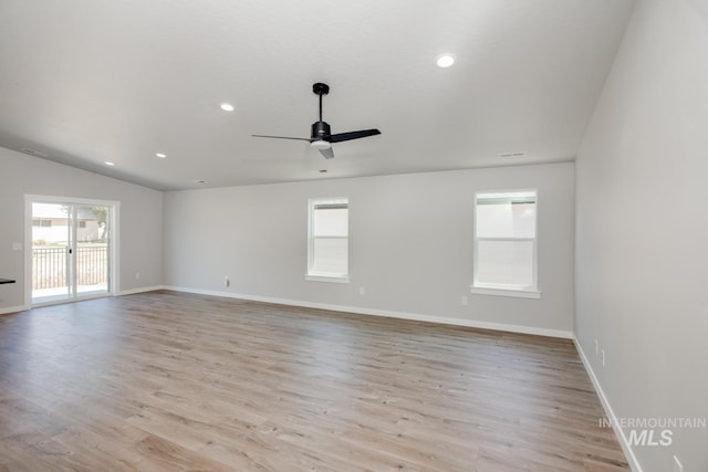 empty room with ceiling fan, light wood-style flooring, baseboards, and recessed lighting