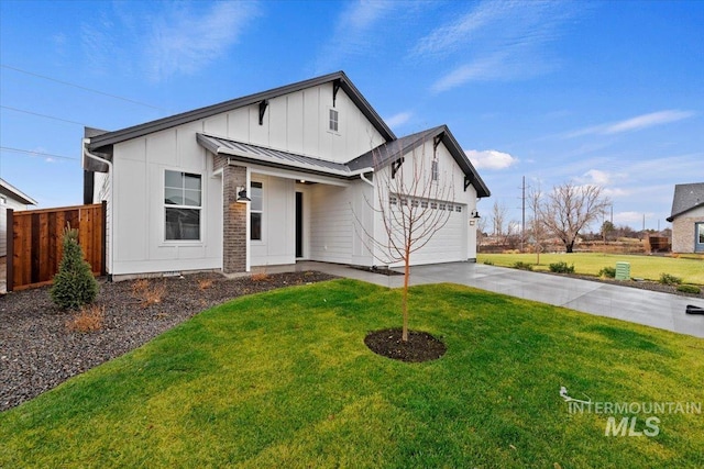 modern inspired farmhouse featuring a garage and a front lawn