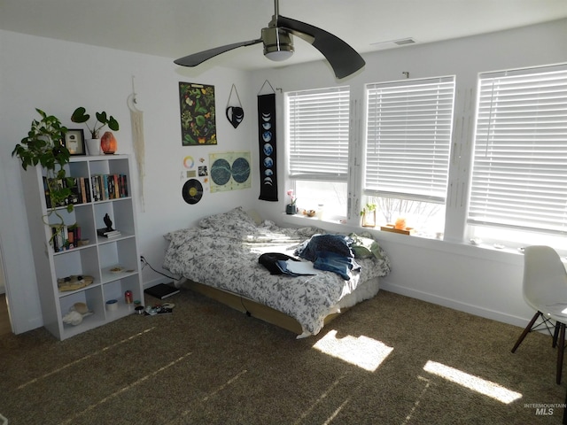 bedroom featuring ceiling fan and dark colored carpet