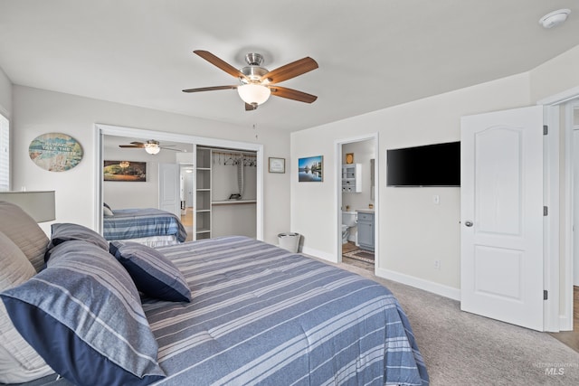 bedroom featuring carpet floors, a closet, connected bathroom, and ceiling fan