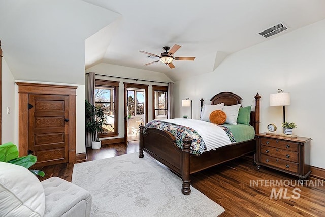 bedroom with dark hardwood / wood-style floors, ceiling fan, access to exterior, and vaulted ceiling