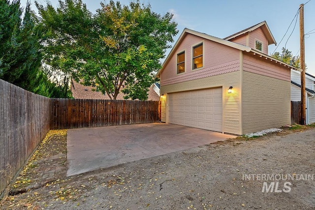 view of property exterior with a garage