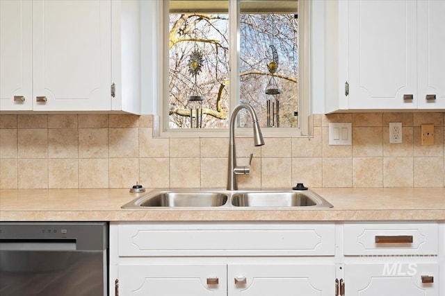 kitchen featuring a sink, dishwasher, white cabinets, and light countertops