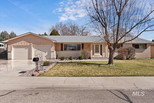 single story home with brick siding, an attached garage, driveway, and a front lawn