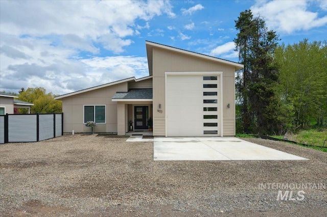 403 Antonette Cir, Cascade, ID 83611 - view of front of house with concrete driveway and a garage
