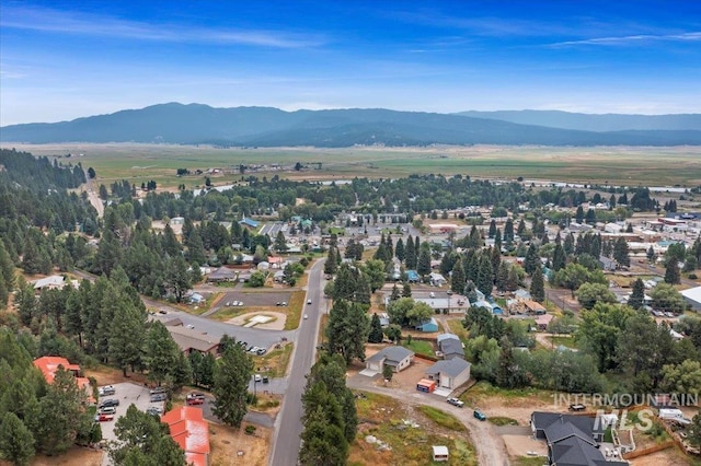 403 Antonette Cir, Cascade, ID 83611 - aerial overview of property's location featuring a mountain backdrop and nearby suburban area