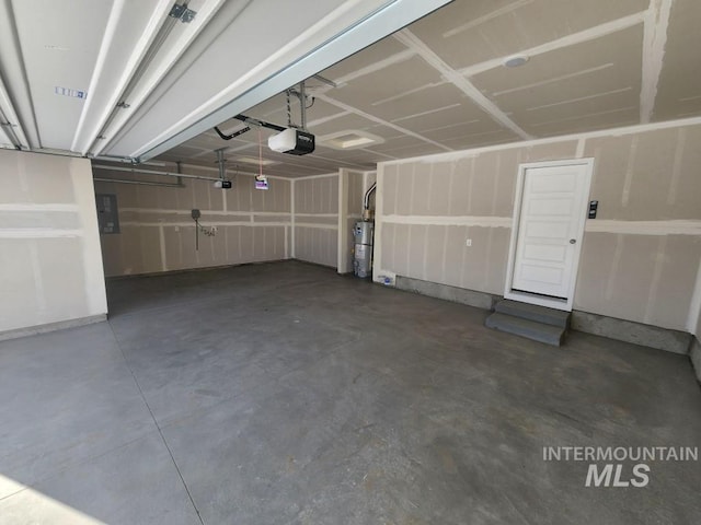 garage featuring electric panel, gas water heater, and a garage door opener