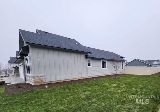 view of home's exterior with a yard