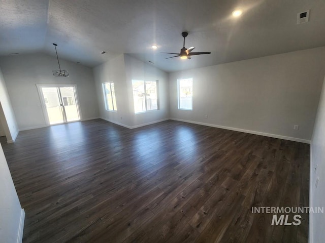 unfurnished room featuring dark hardwood / wood-style floors, ceiling fan, and lofted ceiling