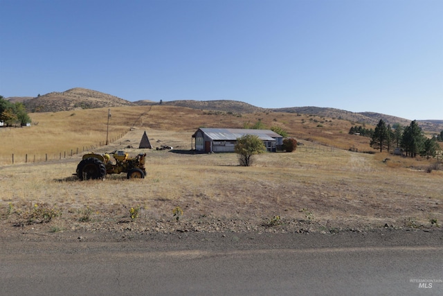 view of mountain feature featuring a rural view