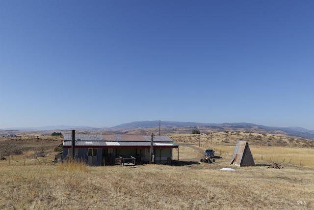 view of mountain feature featuring a rural view