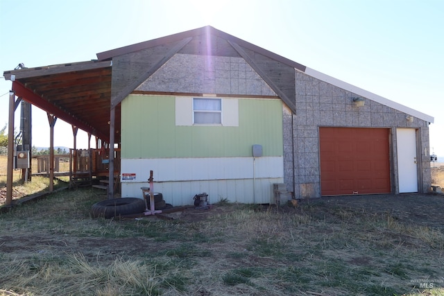 view of property exterior featuring a garage