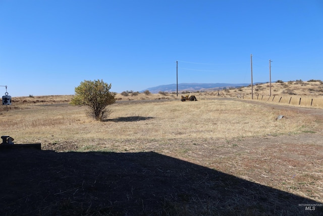 view of yard with a rural view