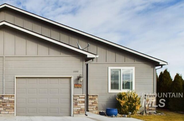 view of side of home featuring a garage