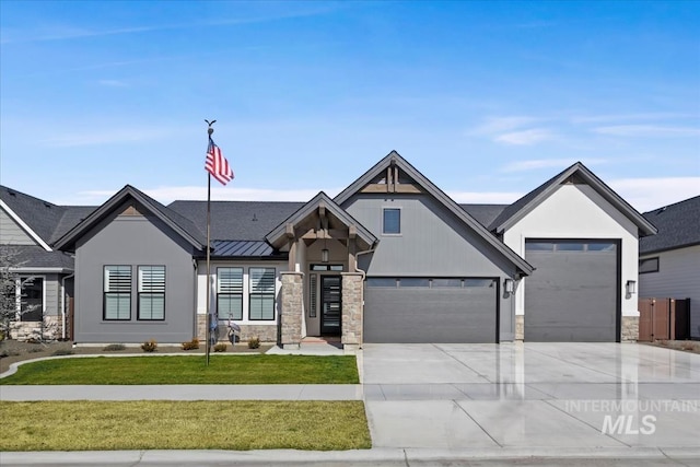 view of front of house featuring driveway, a standing seam roof, metal roof, and a front yard