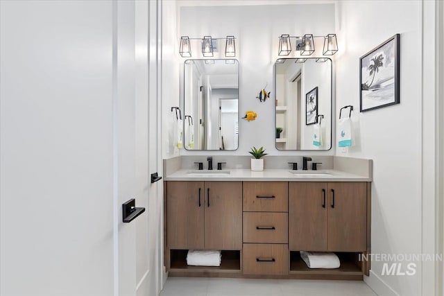 bathroom featuring double vanity and a sink