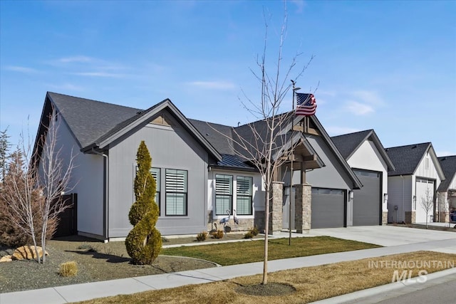 view of front of property with concrete driveway and an attached garage