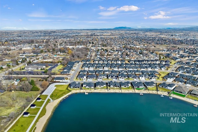 bird's eye view with a water view and a residential view