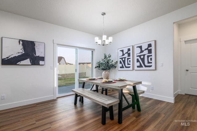 dining space with a chandelier, baseboards, and dark wood-style floors