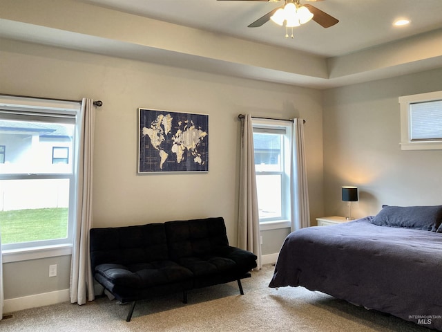 1983 Prospector Way, Twin Falls, ID 83301 - bedroom featuring light carpet, multiple windows, baseboards, and ceiling fan