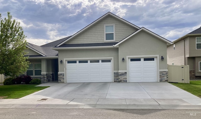 1983 Prospector Way, Twin Falls, ID 83301 - craftsman inspired home with stone siding, driveway, and stucco siding