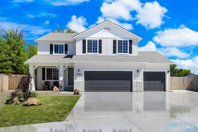 19920 Lenape Ct, Caldwell, ID 83605 - traditional-style home with concrete driveway, a porch, an attached garage, board and batten siding, and a shingled roof